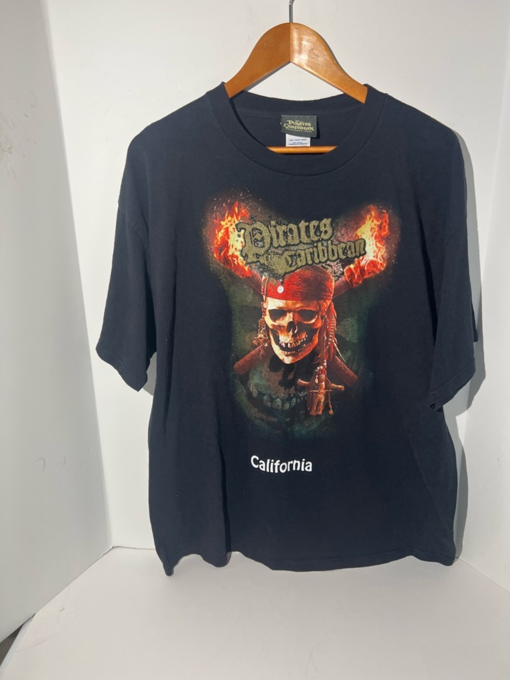 Disney Black Pirates of the Caribbean Skull Graphic Tee with Red Accents